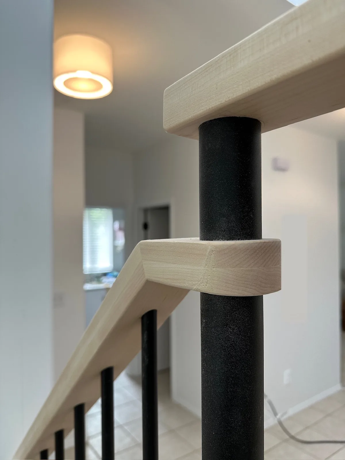 Custom staircase and railing built by Ben's Carpentry in the Edmonton area